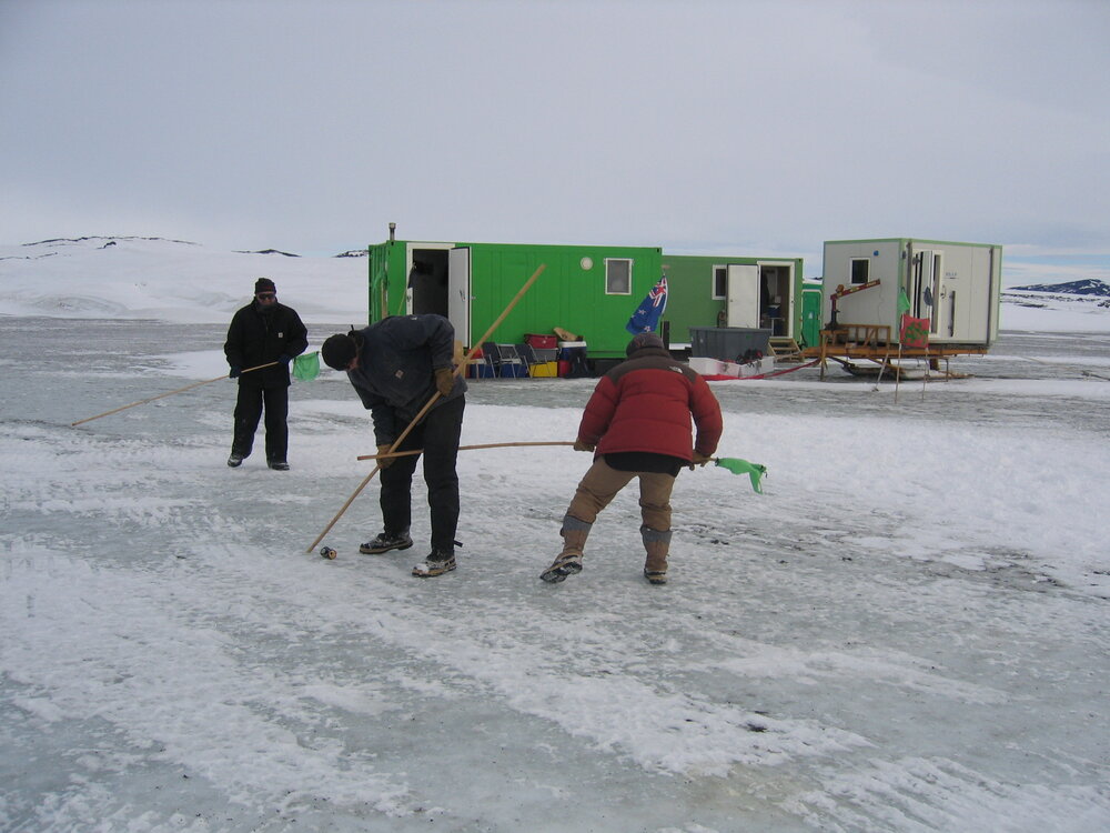 Ice hockey with flag poles and a can