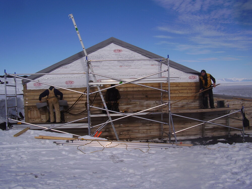 Heritage Carpenters re-installing cladding, east elevation