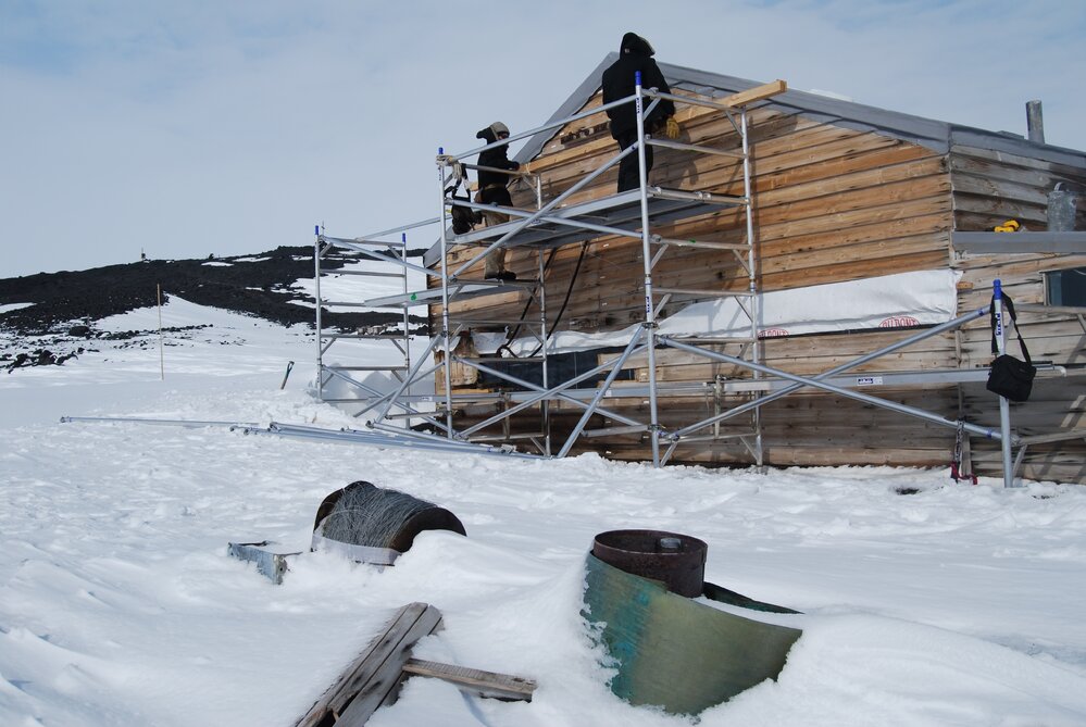 Heritage Carpenters re-installing cladding, east elevation
