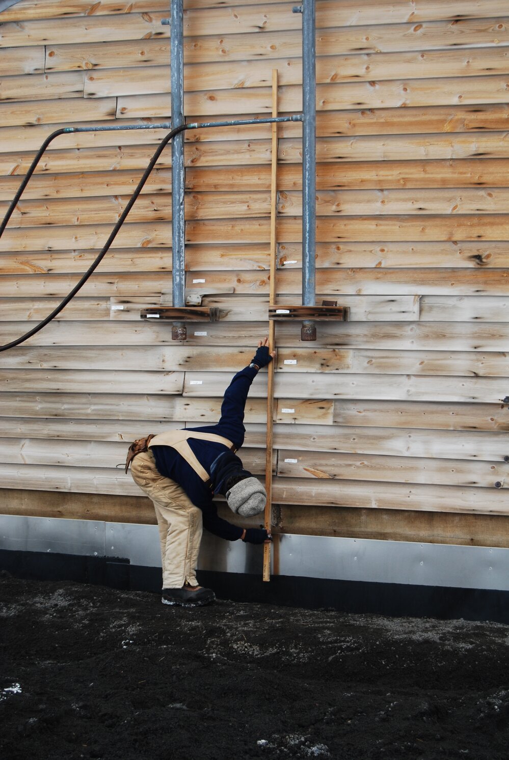 Heritage Carpenter Charley Brentnall measuring east wall