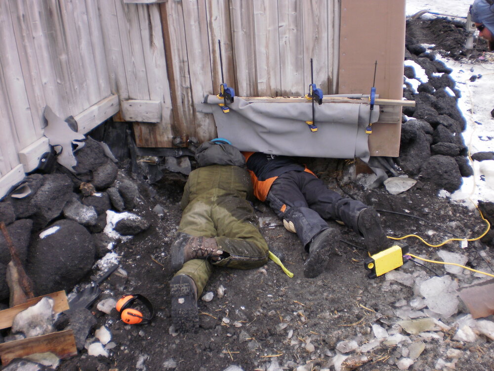 2009-10 AHT's Lucy Skinner and Al Fastier working underneath Shackleton's 'Nimrod' hut
