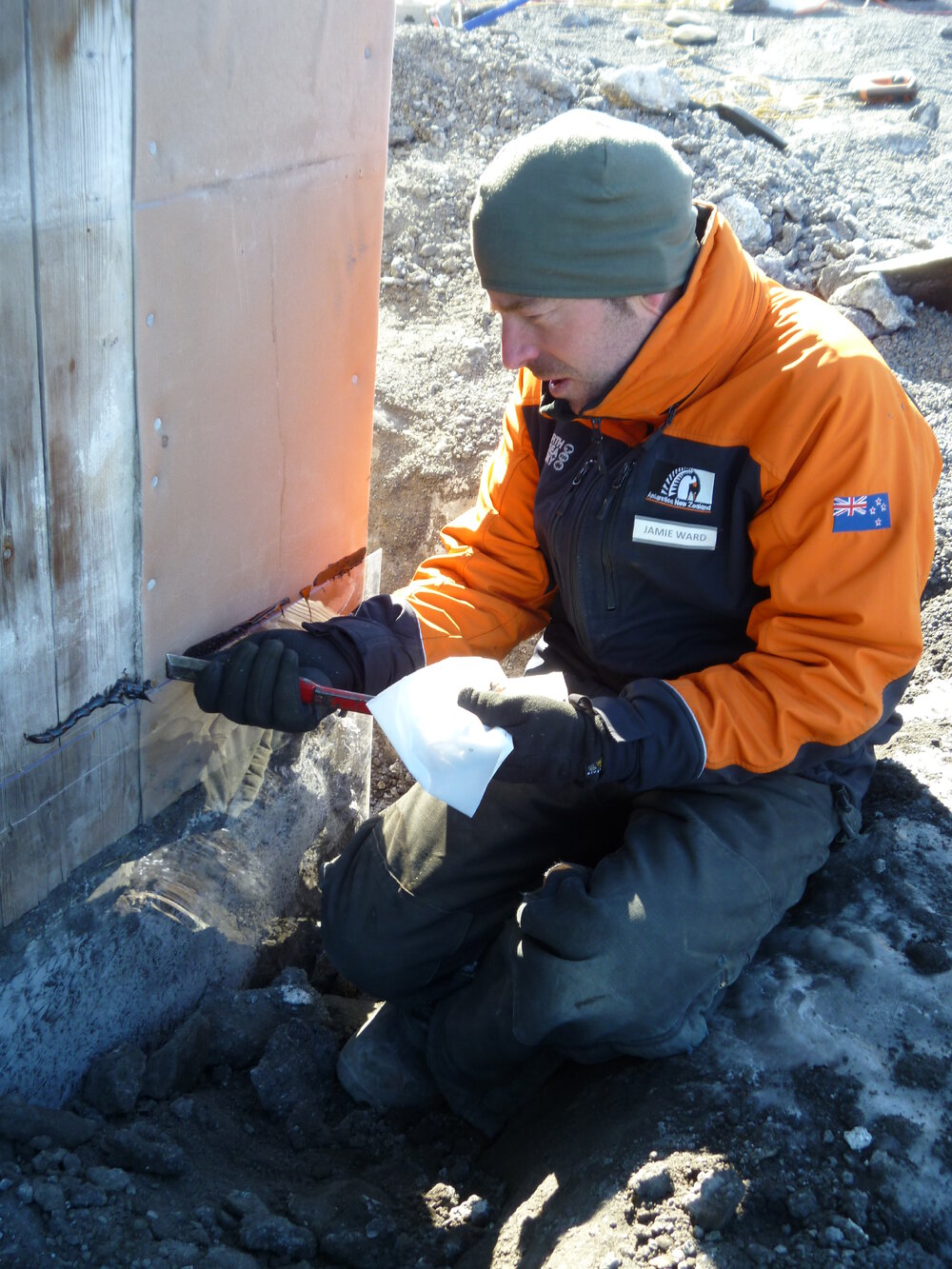 2010-11 Jaime Ward applying mastic during dam installation, Cape Royds