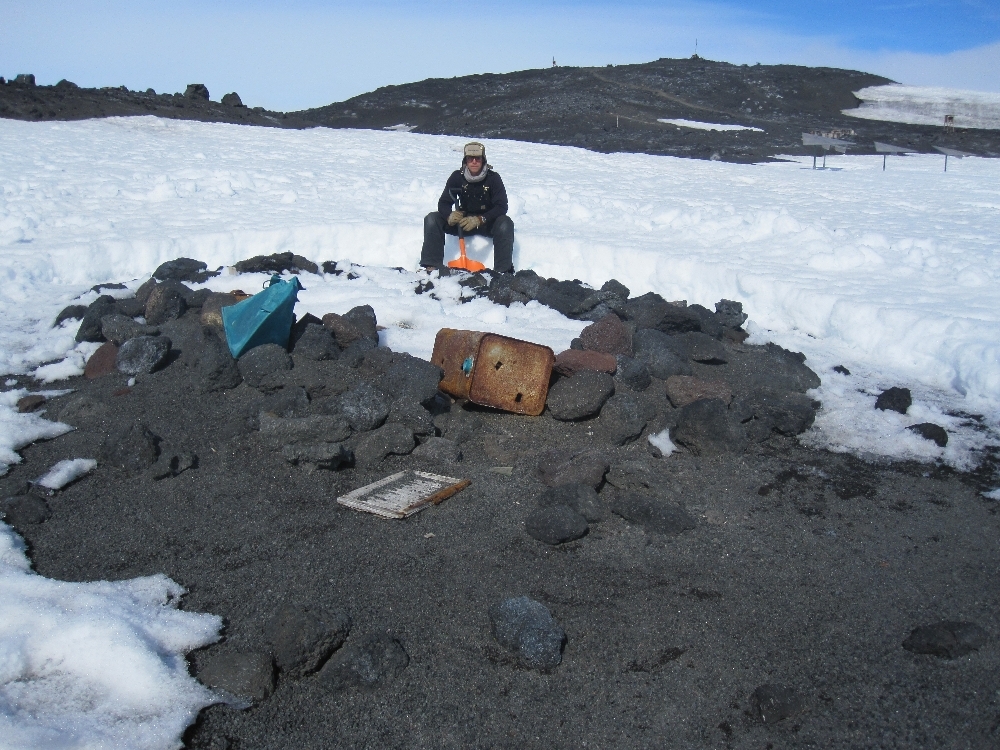 2010-11 Jamie Clarke with the Stone Hut at Cape Evans