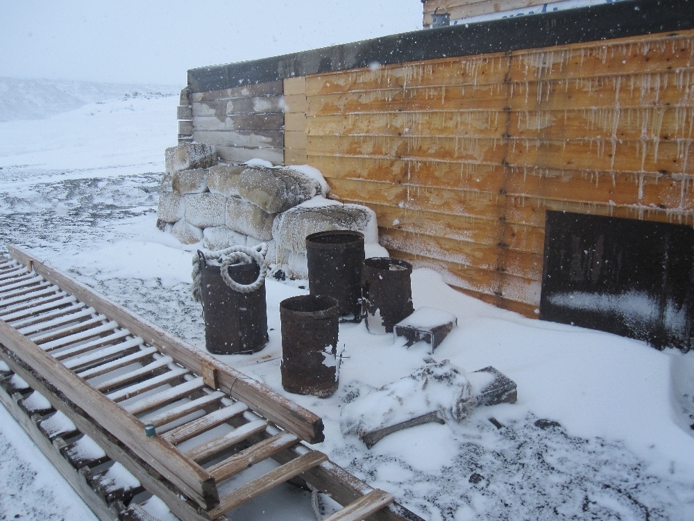 2010-11 Fodder bales and artefacts outside Scott's 'Terra Nova' hut