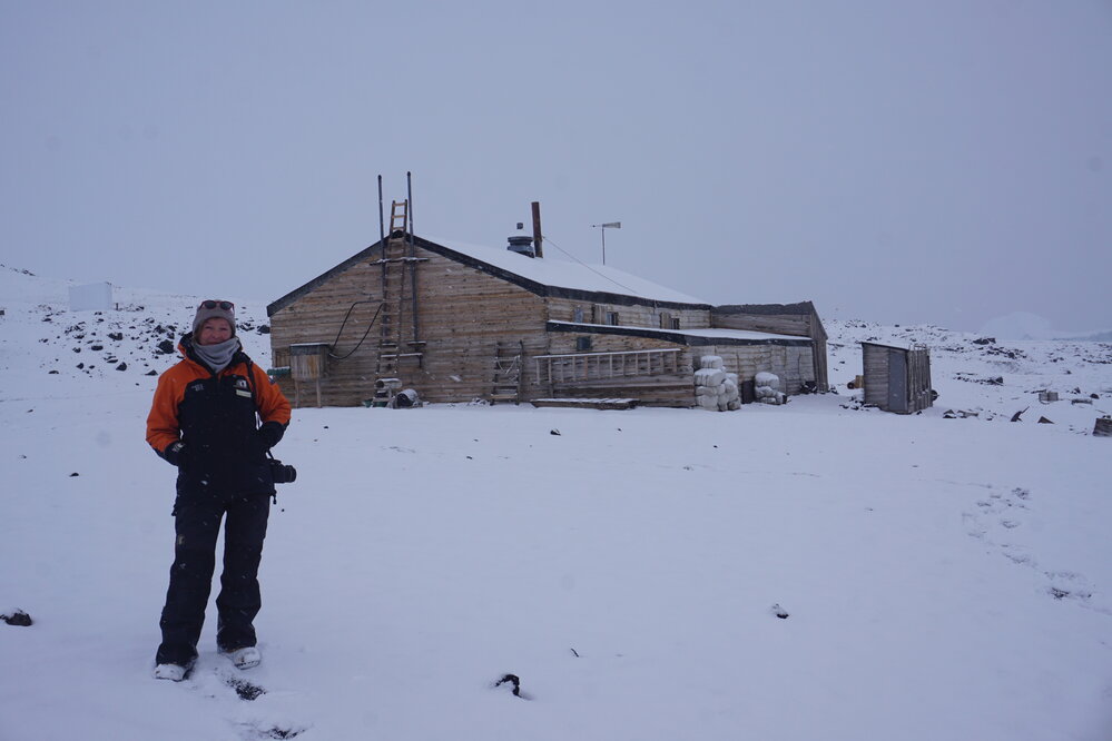 2021-22 AHT's Nicola Stewart outside Scott's 'Terra Nova' hut, Cape Evans
