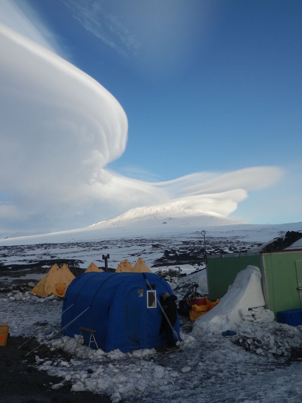 Lenticular clouds, camp and Mount Erebus