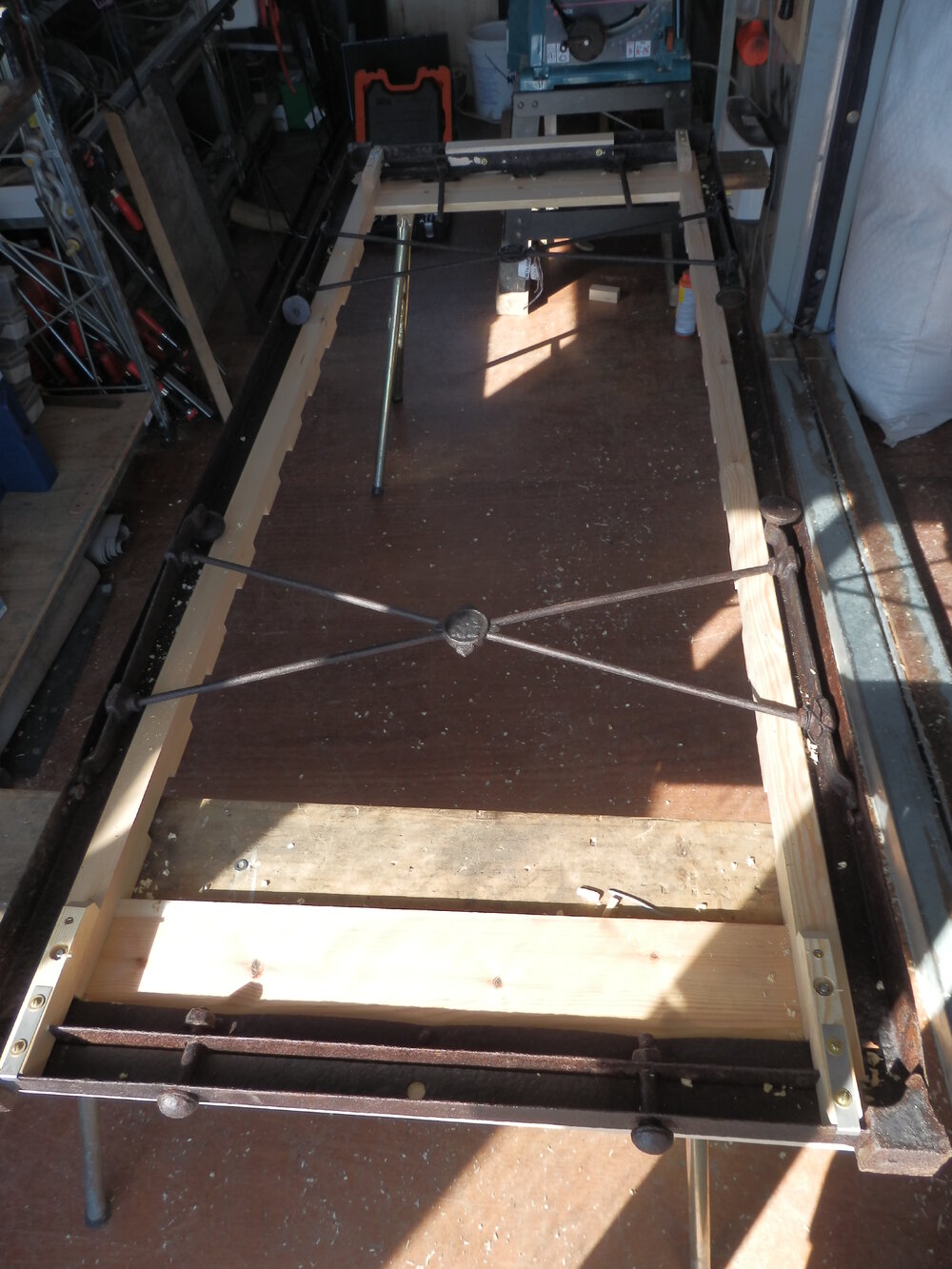 Cape Evans bed frame during repair (001)
