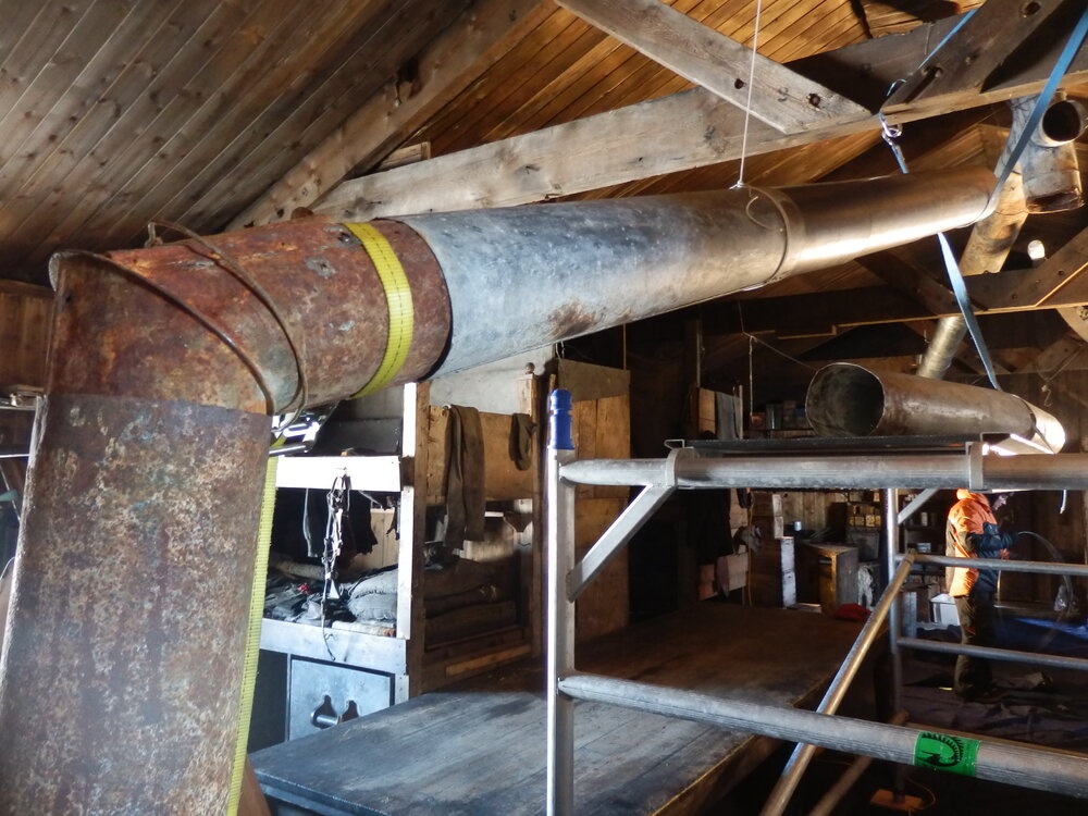 Flue installation in Scott's 'Terra Nova' Hut