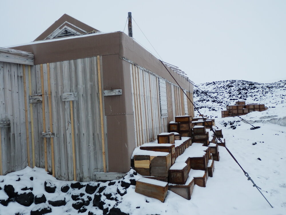 Snow build-up on boxes, Shackleton's 'Nimrod' Hut