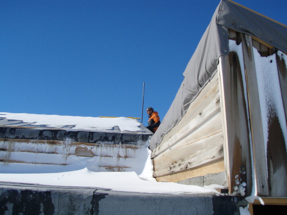 Repairing wind vane, Scott's 'Terra Nova' Hut 