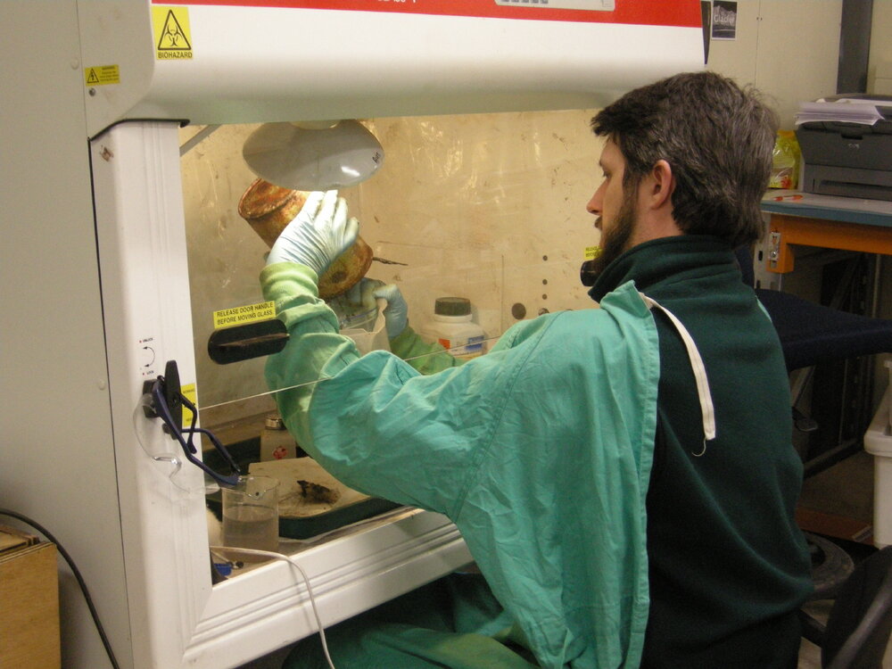 2013-14 Josiah Wagener emptying cans underneath a fume hood (003)