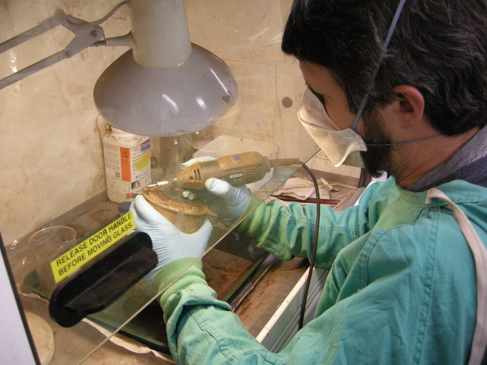 2013-14 Josiah Wagener emptying cans underneath a fume hood (004)