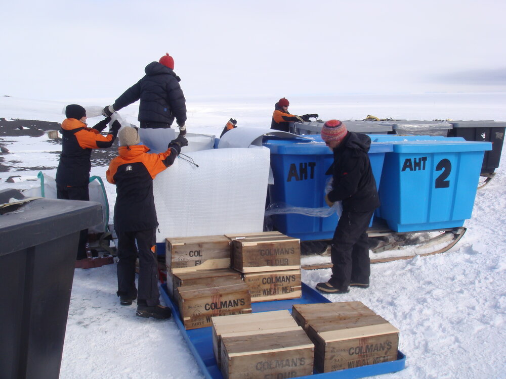 2013-14 AHT team unloading artefacts from cubers, Cape Evans (001)