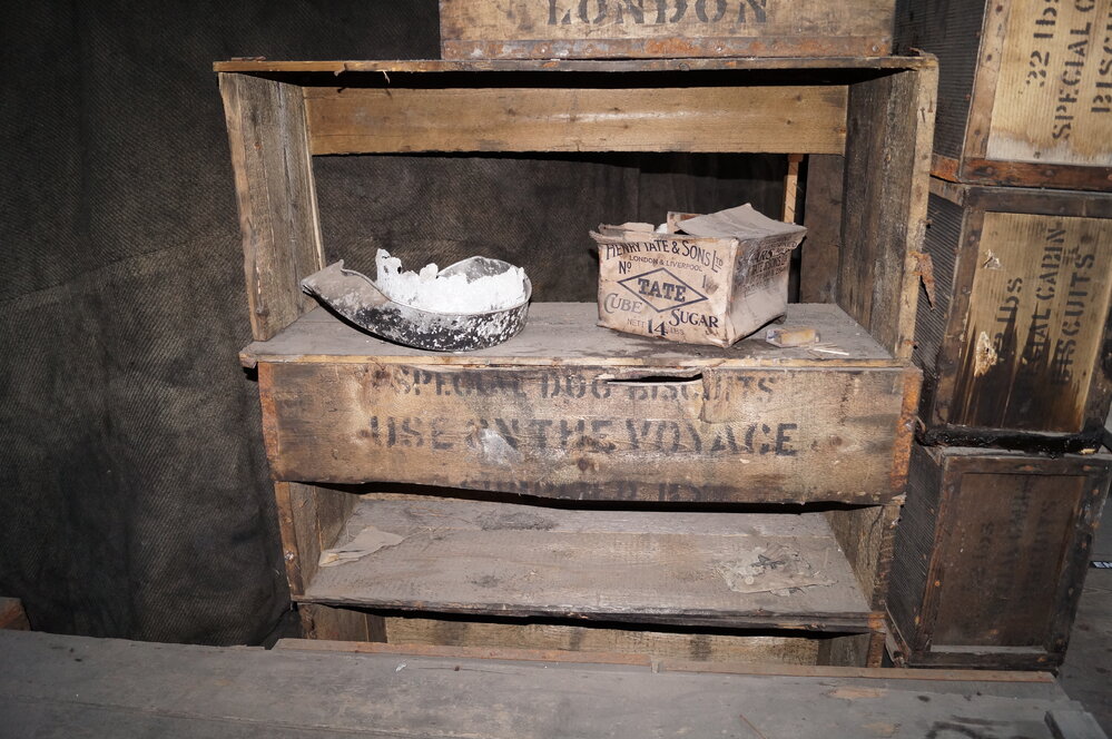 2013-14 Location image, stacked biscuit boxes, Scott's 'Discovery' hut, Hut Point
