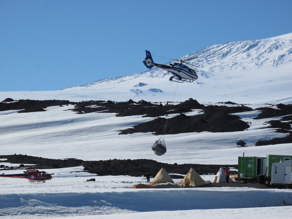 2009-10 Helicopter transporting cargo, Cape Evans field camp