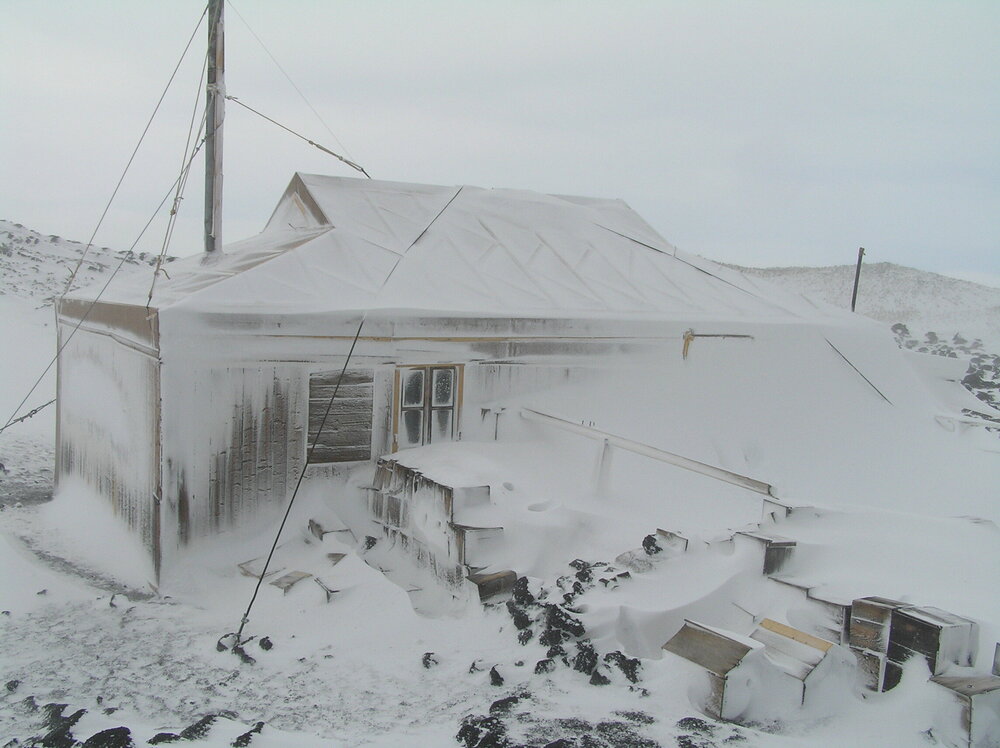 Snow build-up, northeast elevation of Shackleton's 'Nimrod' hut