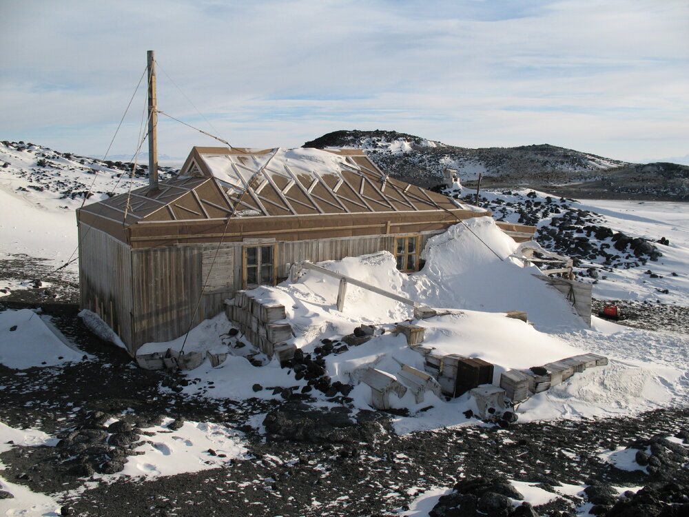 Snow build-up, northeast elevation of Shackleton's 'Nimrod' hut