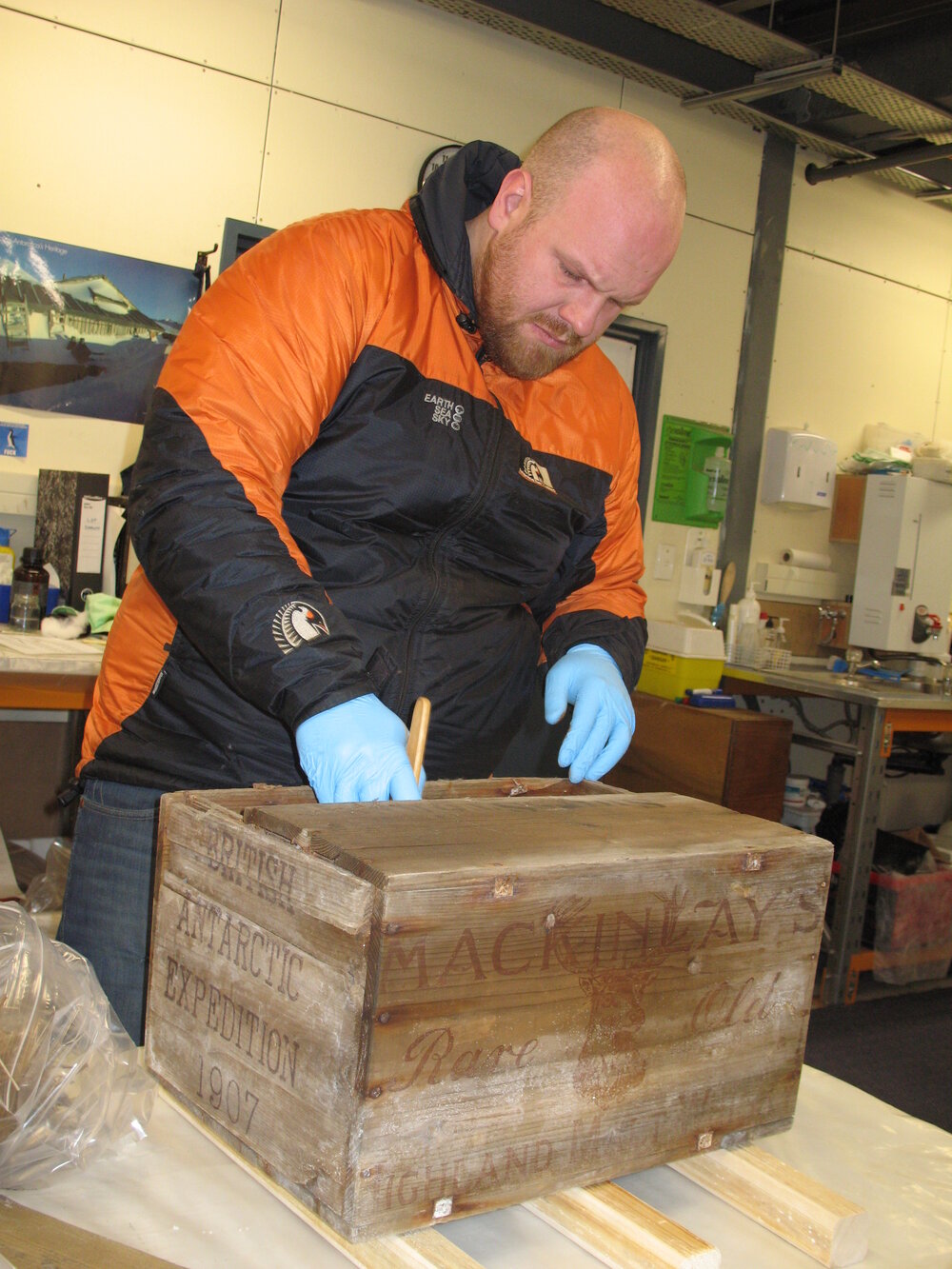 2012 AHT's Stefan Strittmatter treating whisky crate, Scott Base