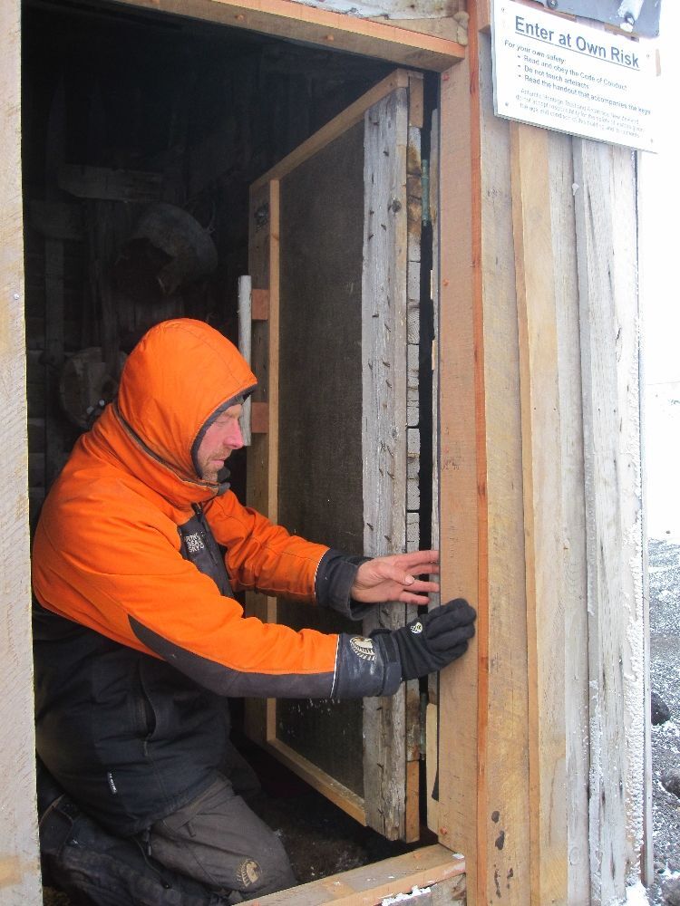 2010-11 Conservators at work, Jaime Ward working at Scott's 'Terra Nova' hut