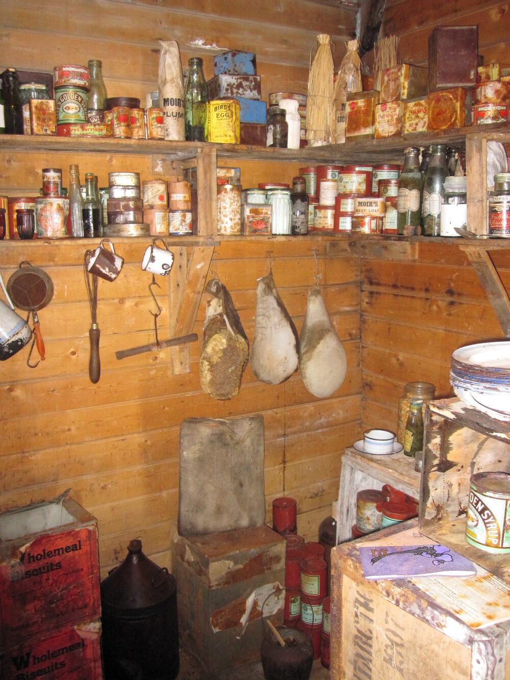 2010-11 Food provisions stacked on shelves inside Shackleton's 'Nimrod' hut