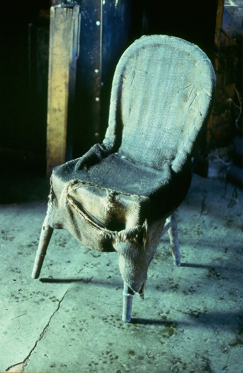 Wooden framed chair with improvised sacking cover, messdeck