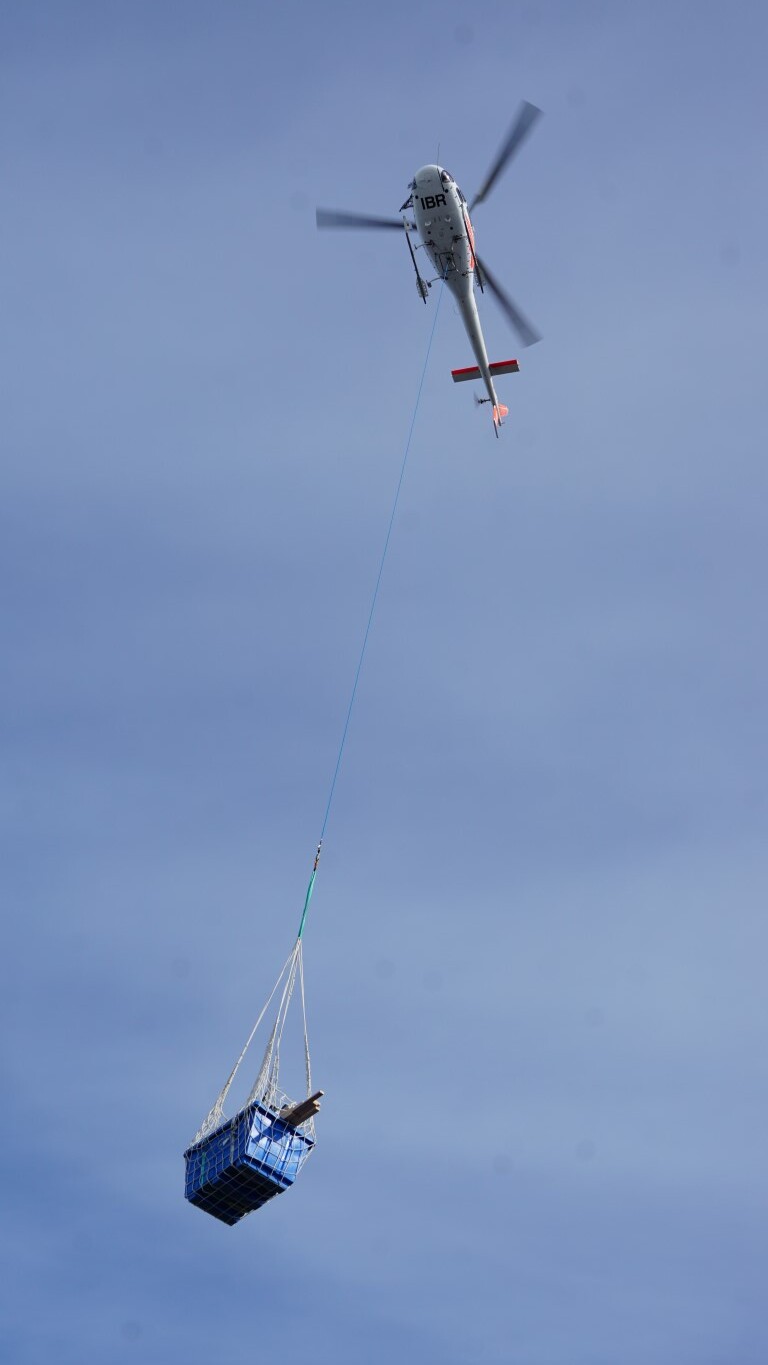 2022-23 Helicopter delivering artefacts and equipment, Cape Royds