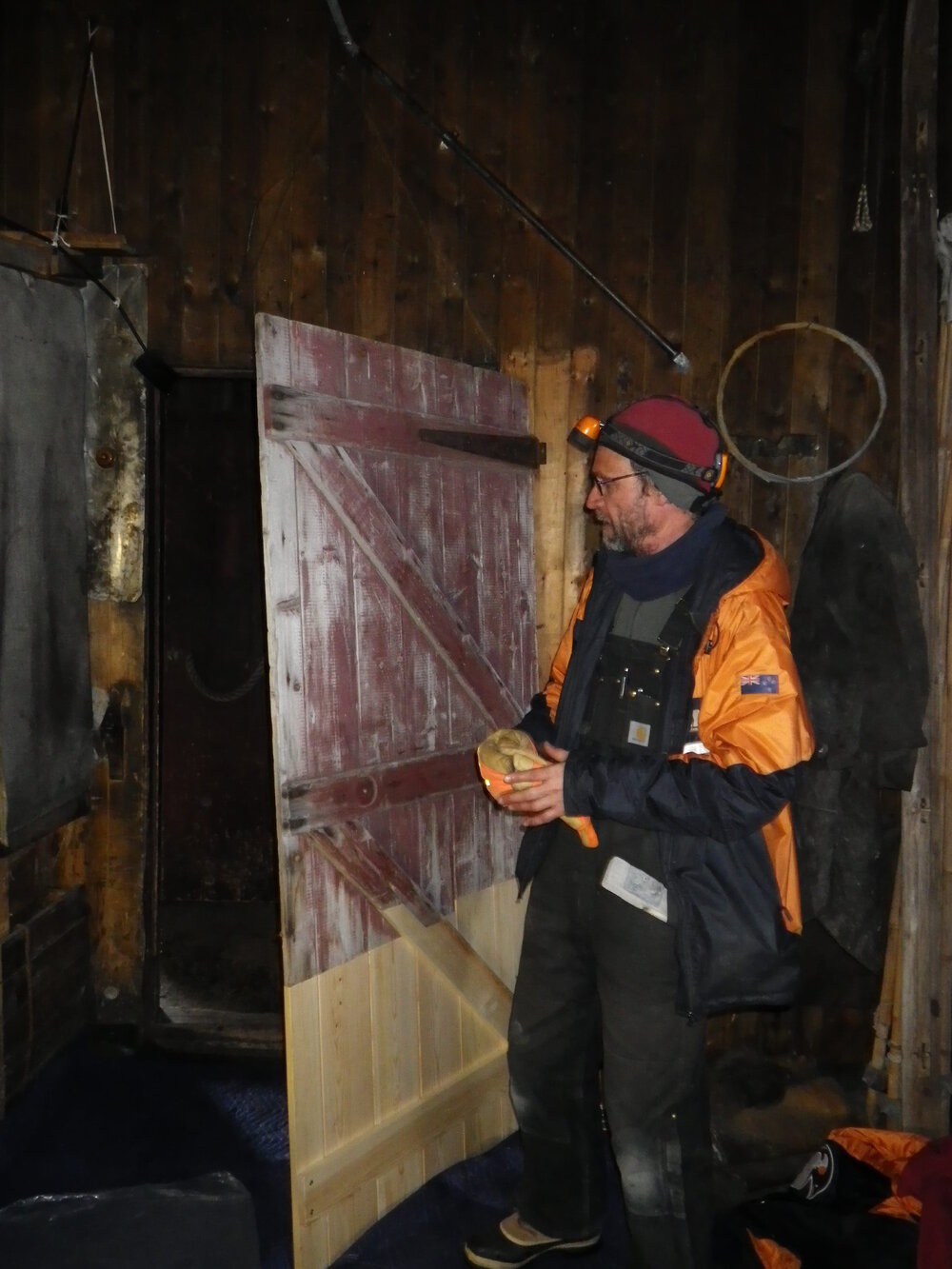 Reinstalling door, Scott's 'Terra Nova' hut