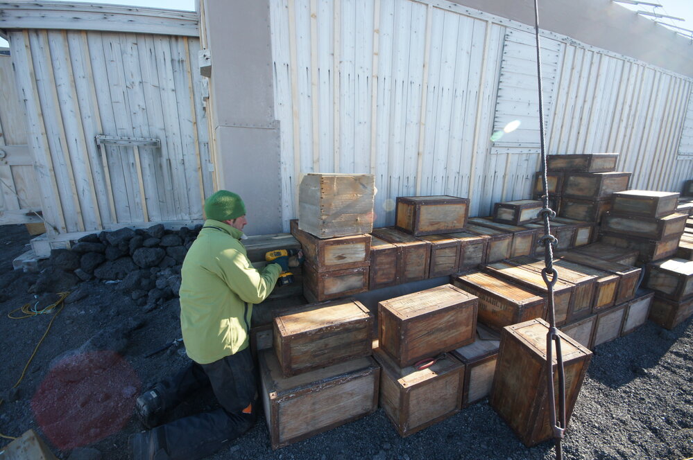 Reinstalling Venesta cases, Shackleton's 'Nimrod' hut 