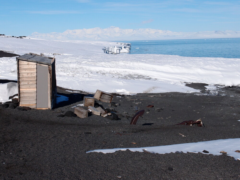 Latrine, boxes and anchor outside Scott's 'Terra Nova' hut