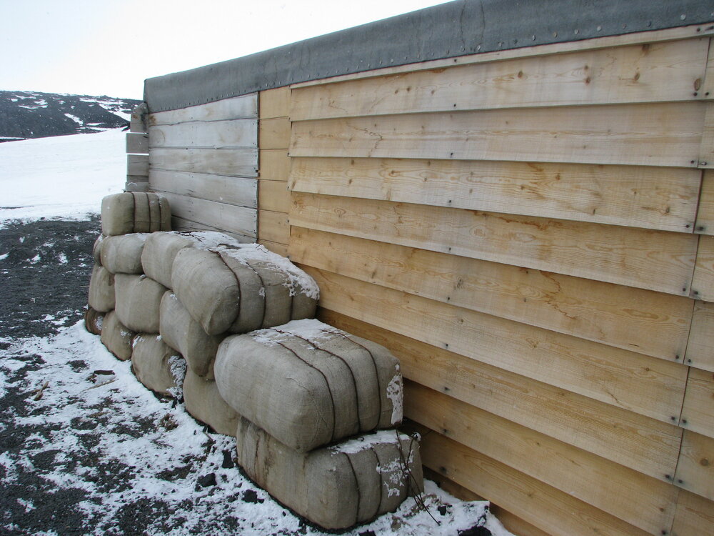 2010-11 Fodder bales stacked outside the Stables, Cape Evans
