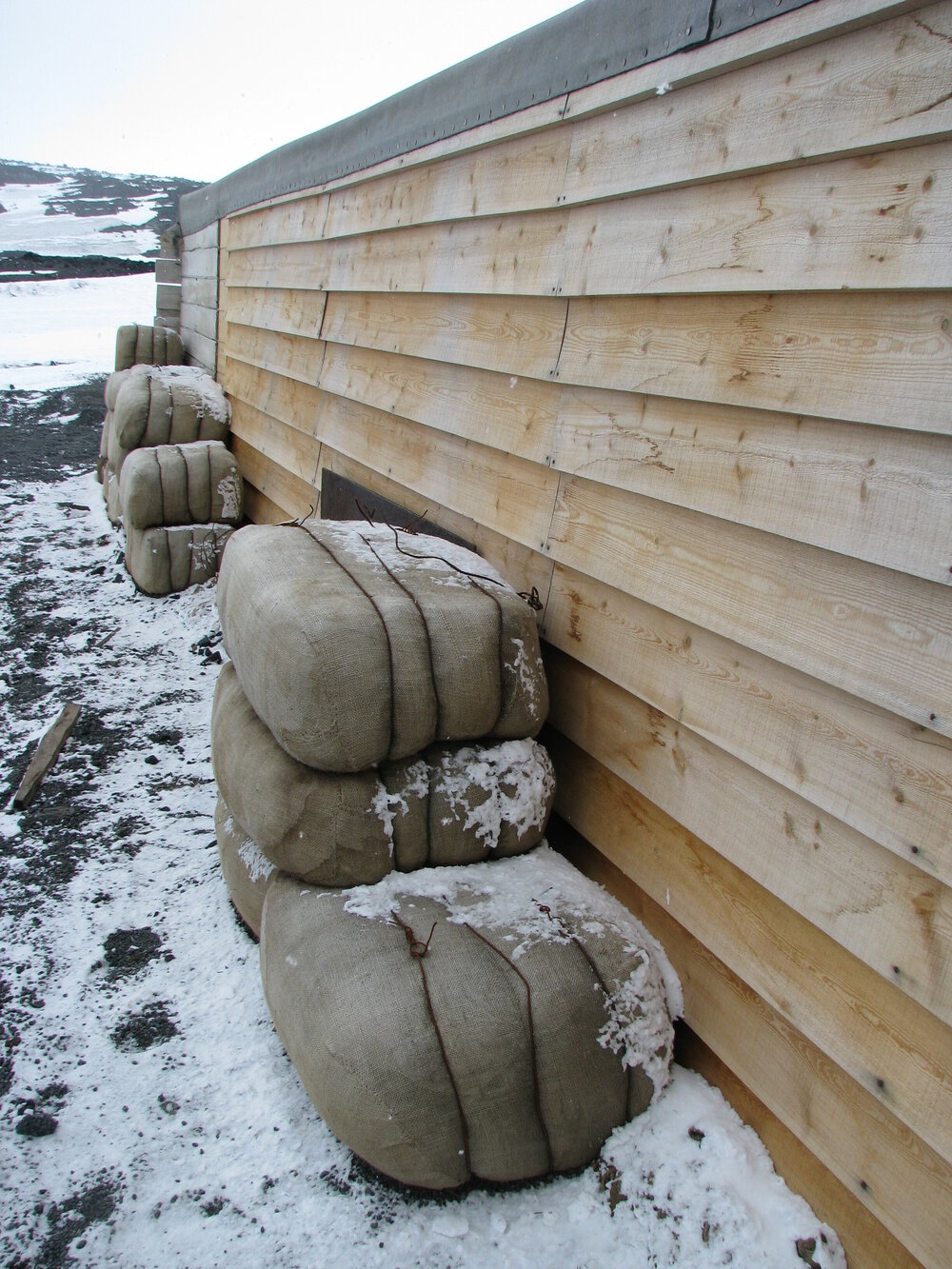 2010-11 Fodder bales stacked outside the Stables, Cape Evans