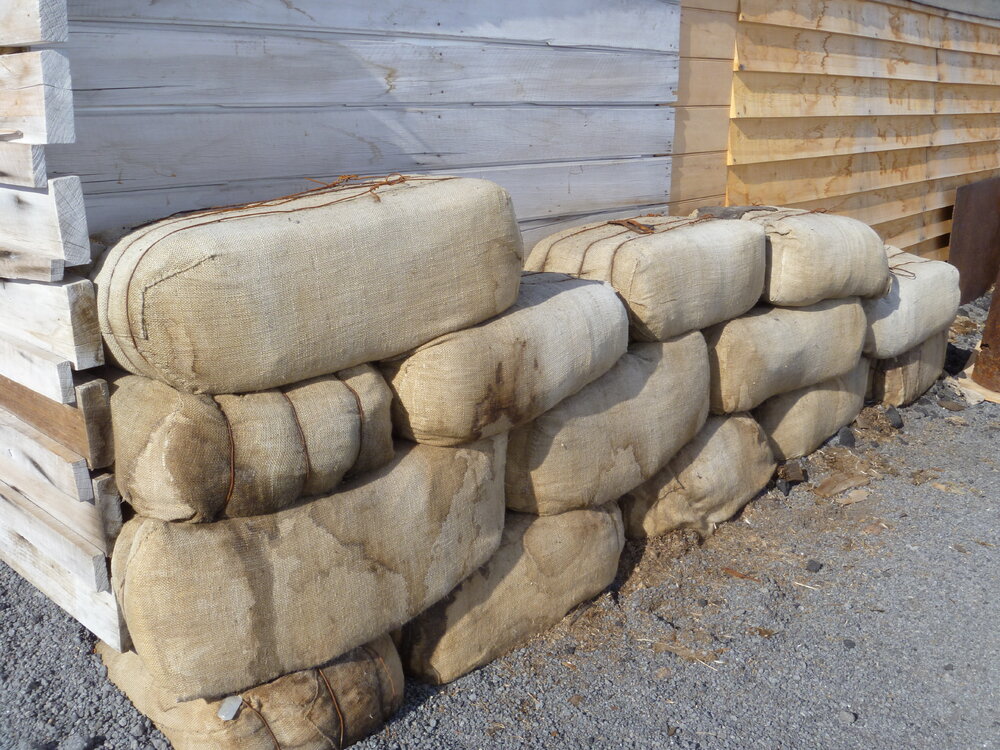 2010-11 Fodder bales stacked outside the Stables, Cape Evans