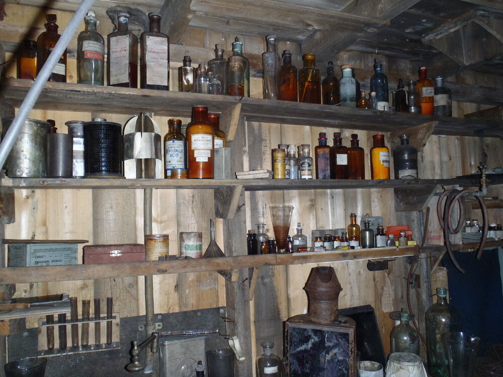 2010-11 Photographic supplies on the shelves within the Darkroom, Cape Evans