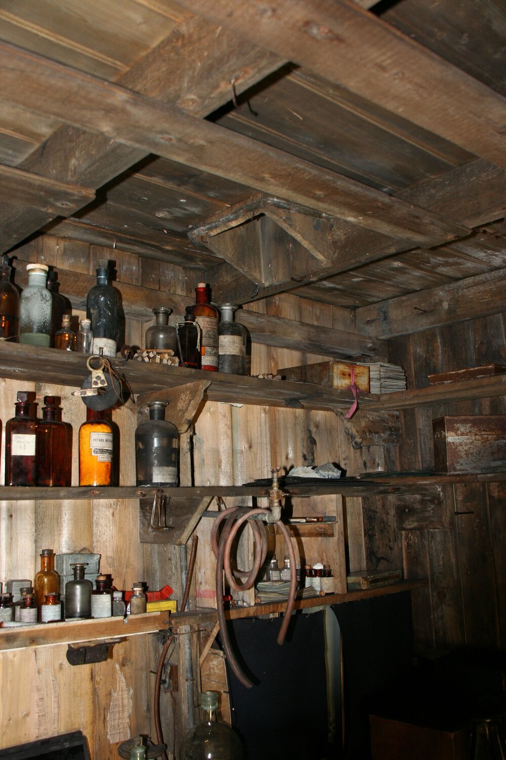 2010-11 Photographic supplies on the shelves within the Darkroom, Cape Evans