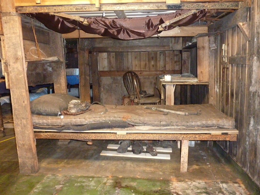 2010-11 Bulkhead removed showing Taylor's bunk, Cape Evans
