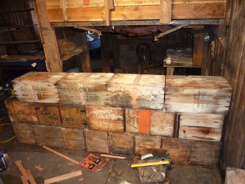2010-11 Third layer of boxes in the bulkhead, Cape Evans