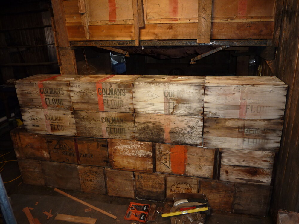 2010-11 Fourth layer of boxes in the bulkhead, Cape Evans
