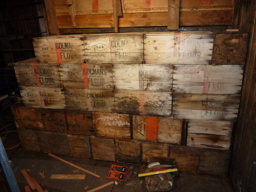 2010-11 Fifth layer of boxes in the bulkhead, Cape Evans