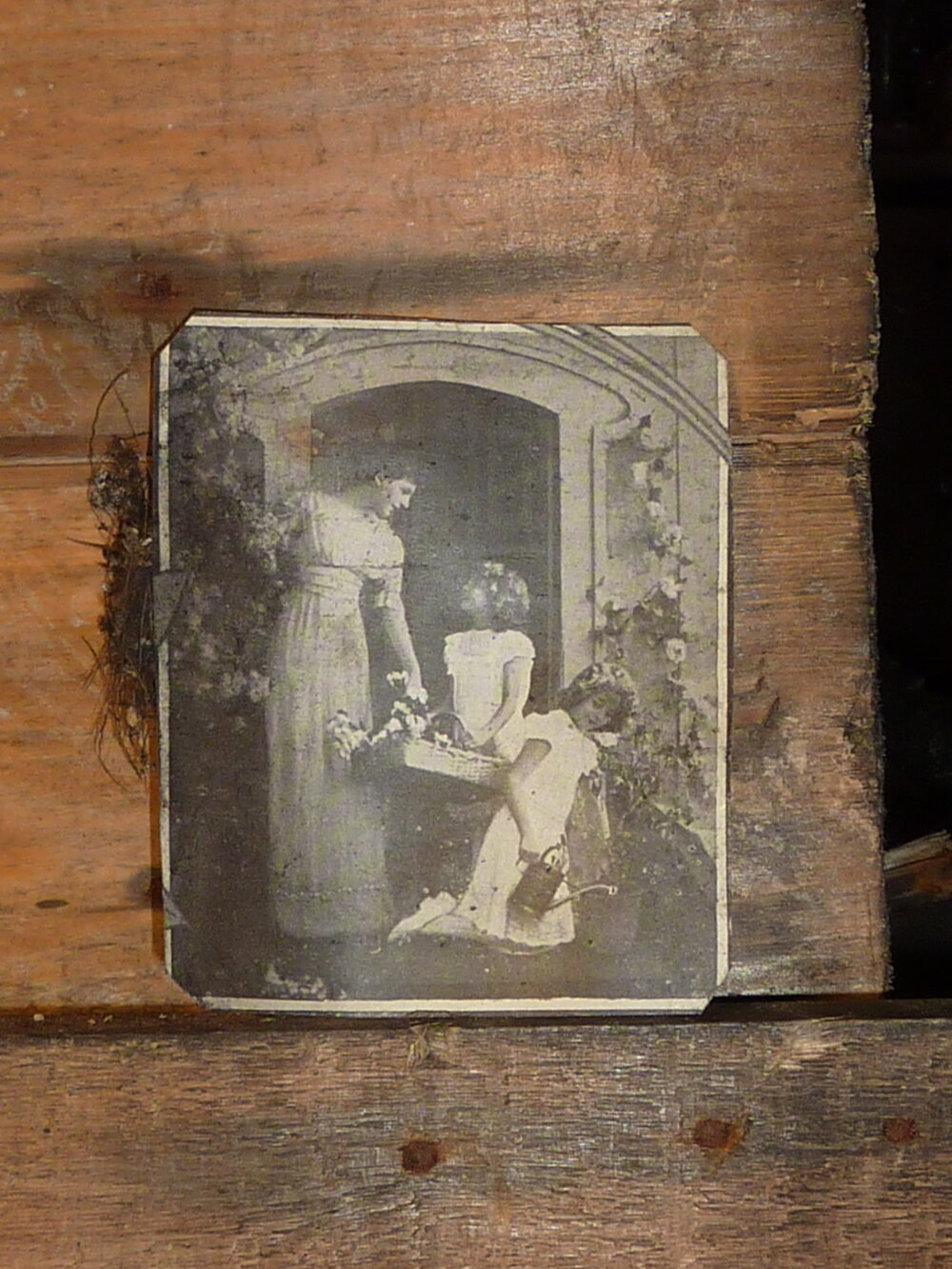 2010-11 Image of a woman with two children inside Scott's 'Terra Nova' hut