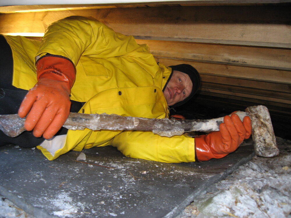 2010-11 John Taylor underneath Shackleton's 'Nimrod' hut, Cape Royds