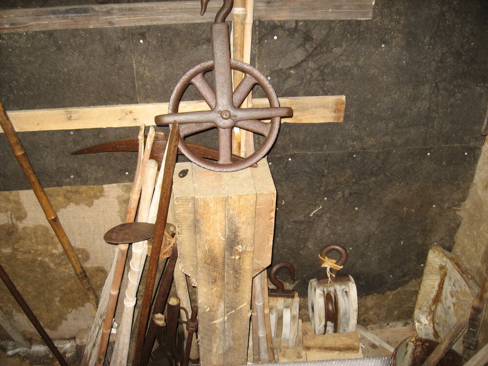 2010-11 Wheel pulley and other tools inside Mawson's laboratory, Cape Royds