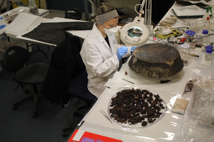 2014 AHT winter conservators at work - Stefanie White treating pan with seal meat (002)