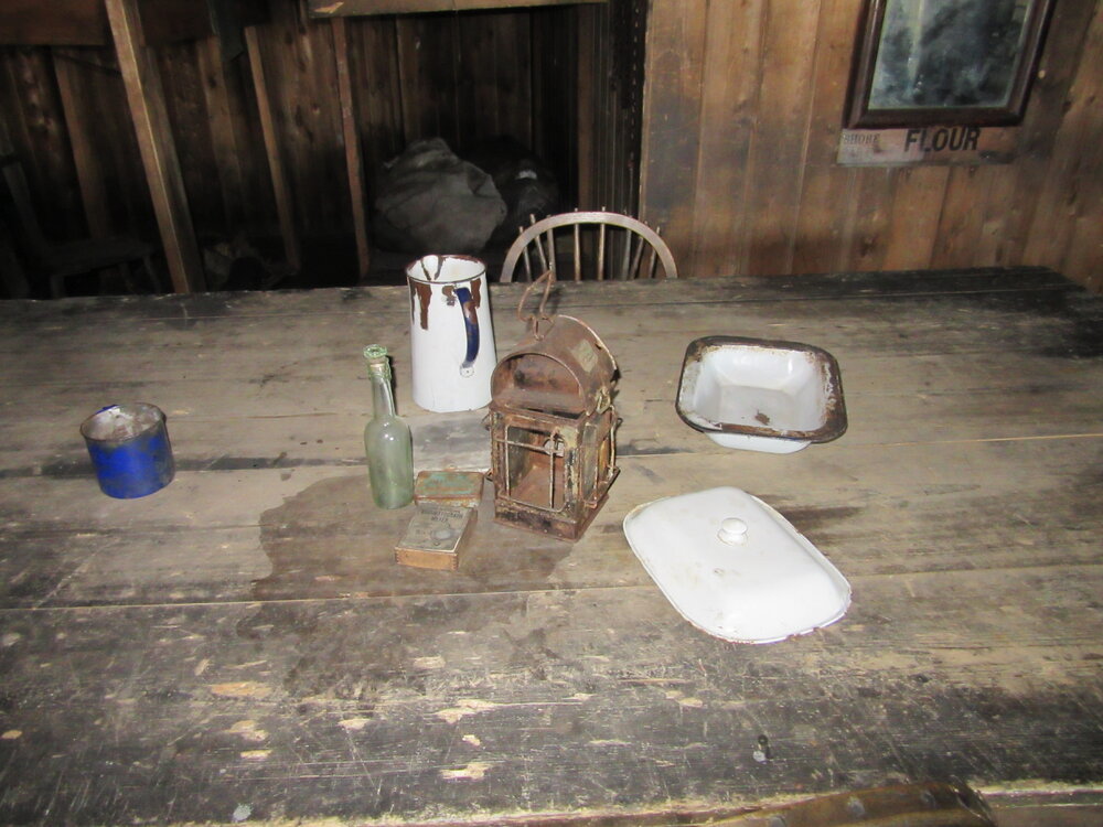 2015-16 Artefacts on Wardroom table, Scott's 'Terra Nova' hut
