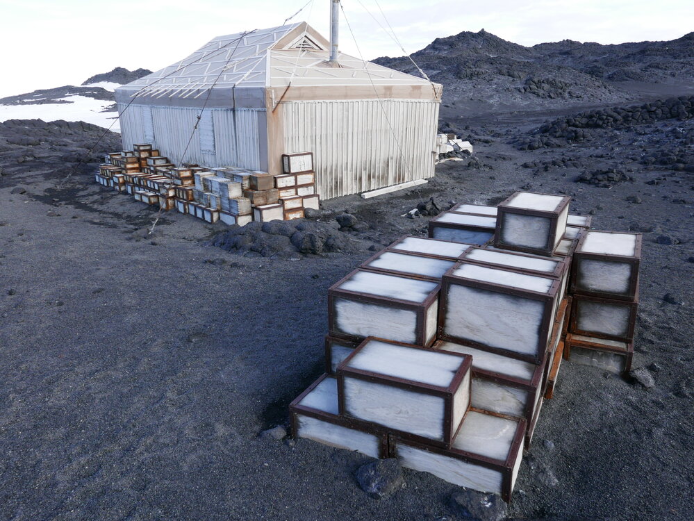 2018-19 Venesta cases stacked outside Shackleton's 'Nimrod' hut, Cape Royds