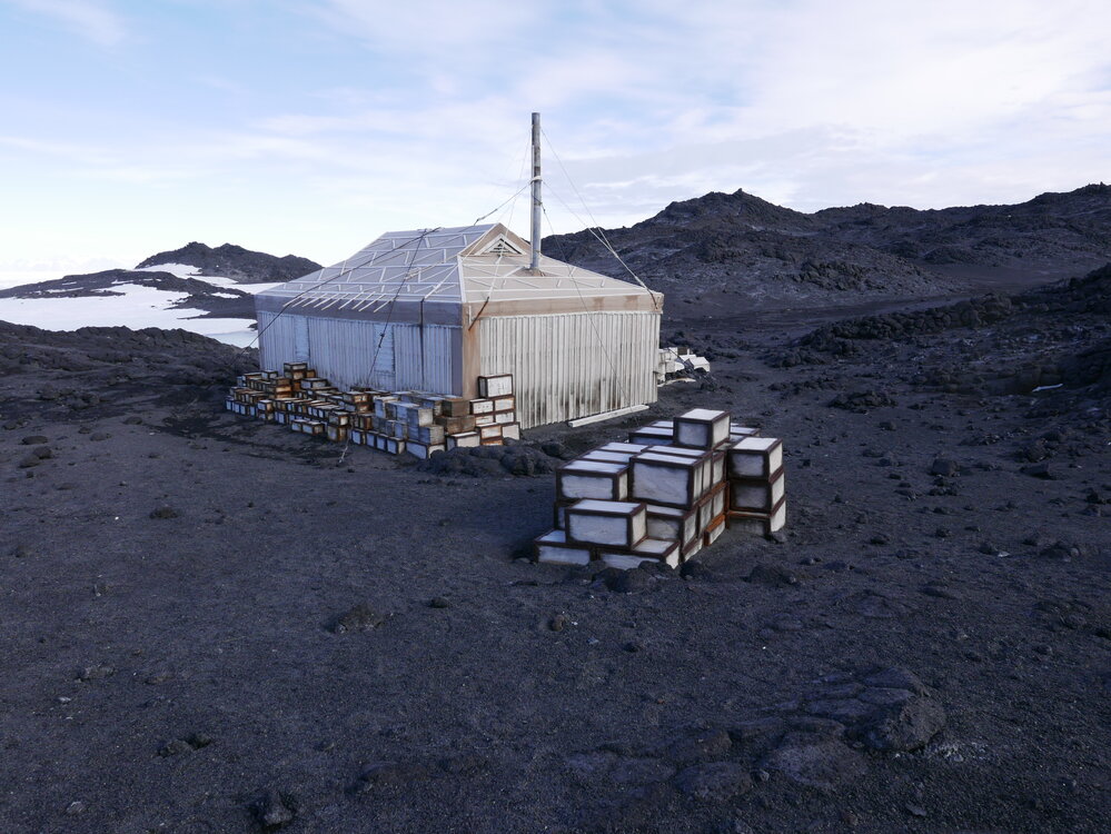 2018-19 Venesta cases stacked outside Shackleton's 'Nimrod' hut, Cape Royds