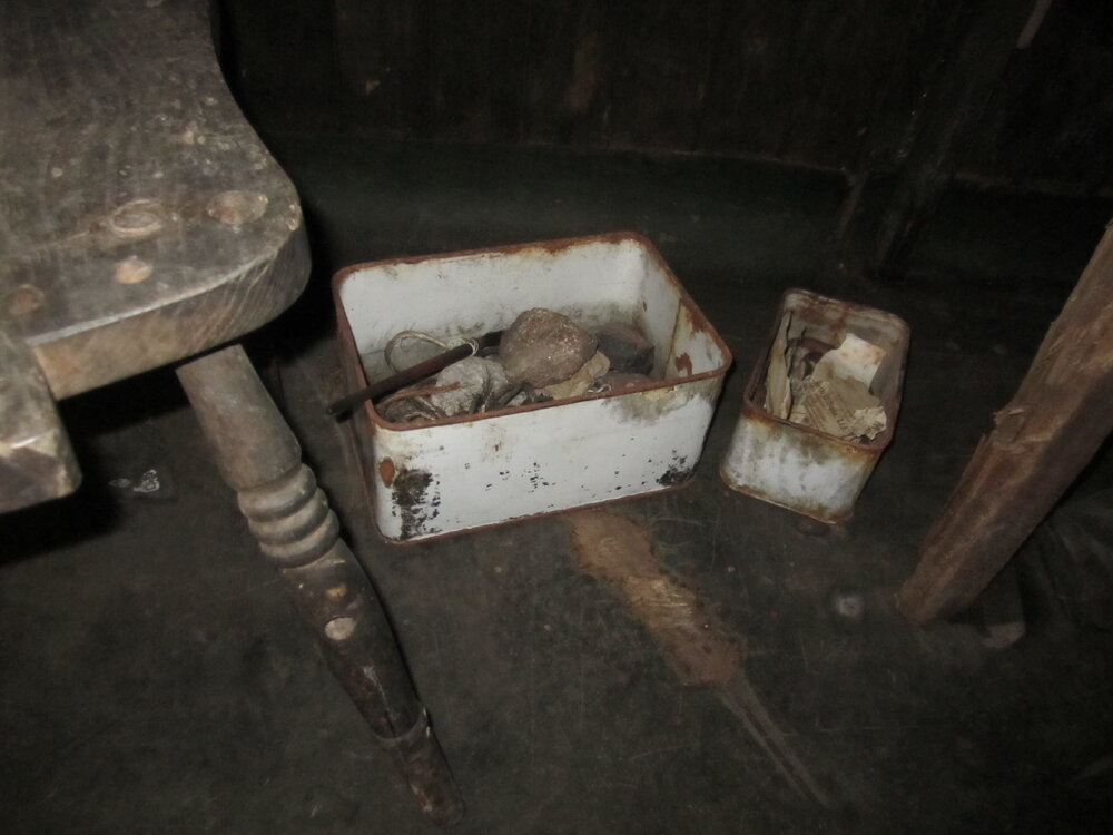 Artefacts under geology bench, Scott's 'Terra Nova' hut (001)