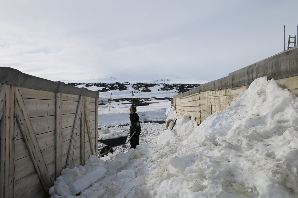 2013-14 Nicola Dunn moving snow, Scott's 'Terra Nova' hut, Cape Evans