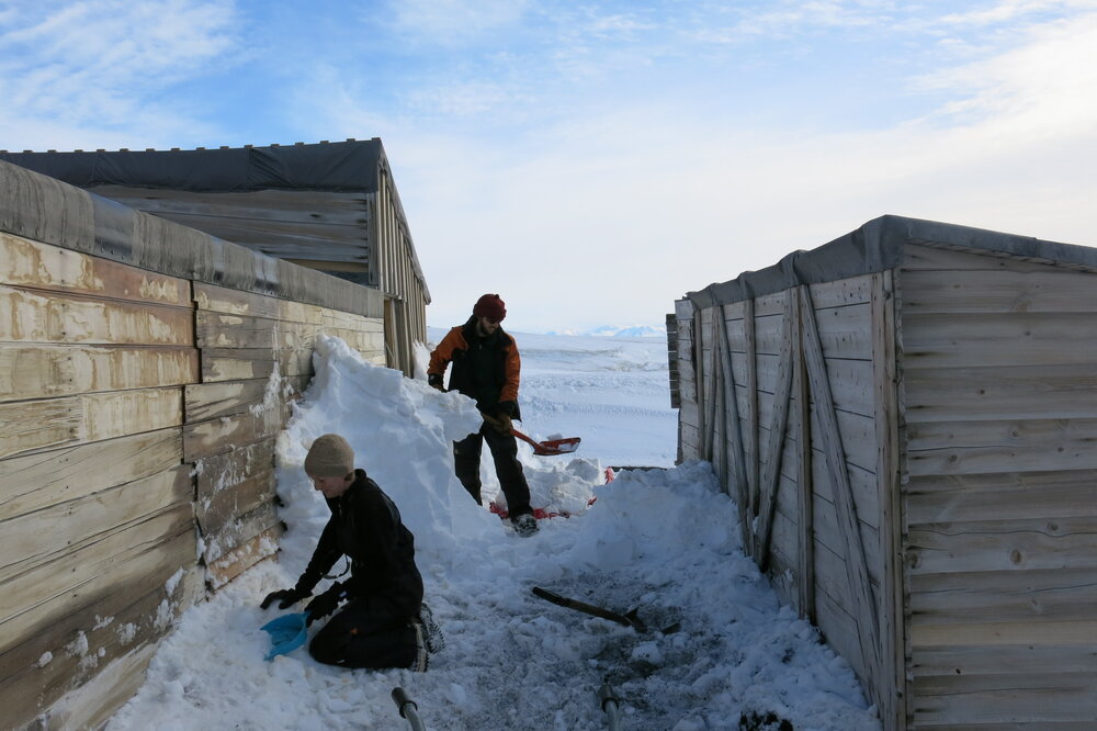 2013-14 Nicola Dunn and Josiah Wagener moving snow, Scott's 'Terra Nova' hut, Cape Evans