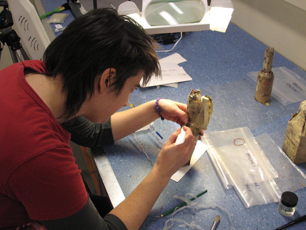 AHT Conservator Lizzie Meek treating a bottle of Savoy Sauce