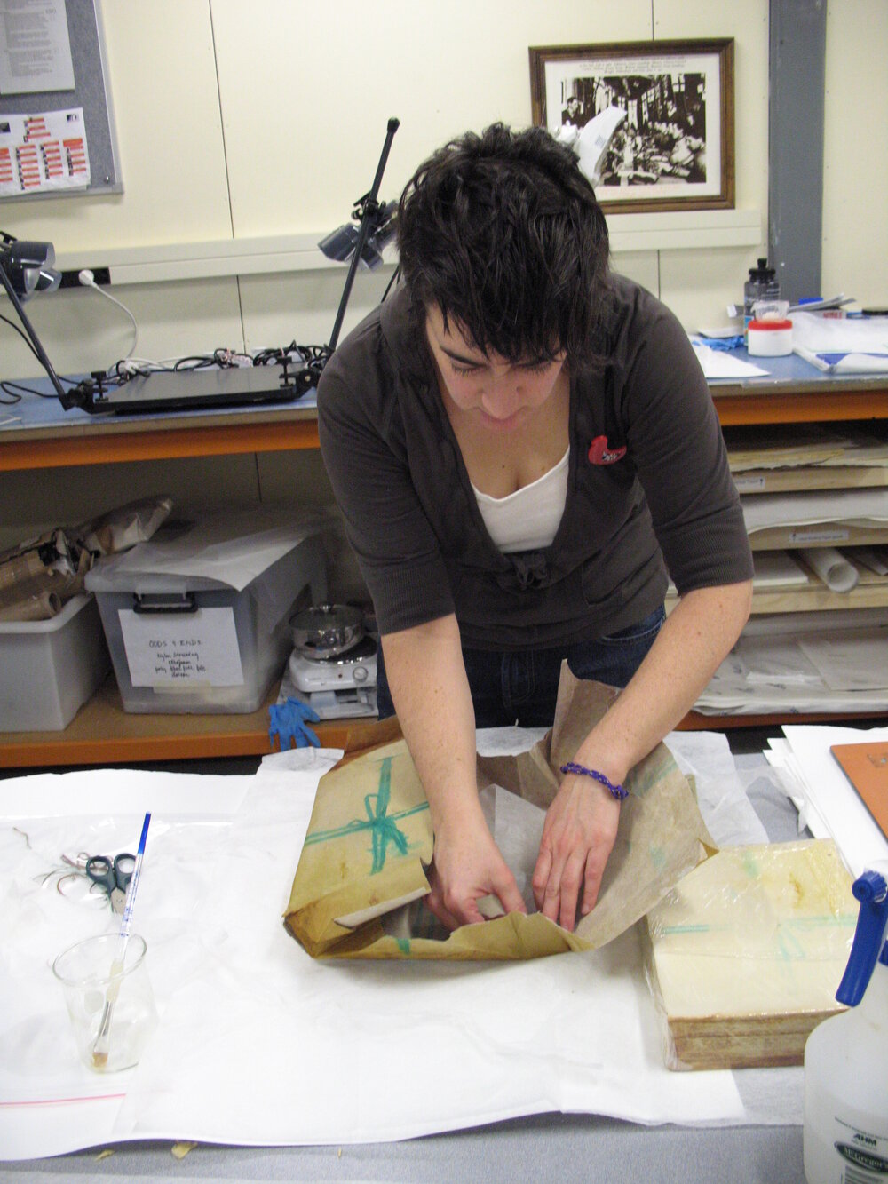 AHT Conservator Lizzie Meek treating Aurora Australis paper